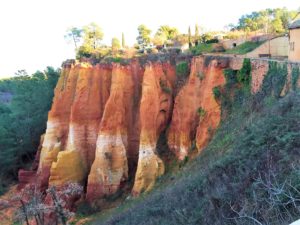 Ochre colored village in Provence France named Roussillon.